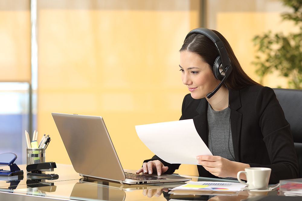 virtual assistants on laptop with headset during virtual assistant job interview, virtual office temps